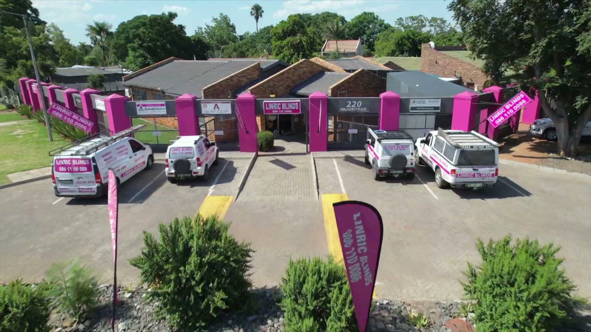 The Linric Blinds premises at 220 Kruger Street, Rustenburg, with the branded fleet outside