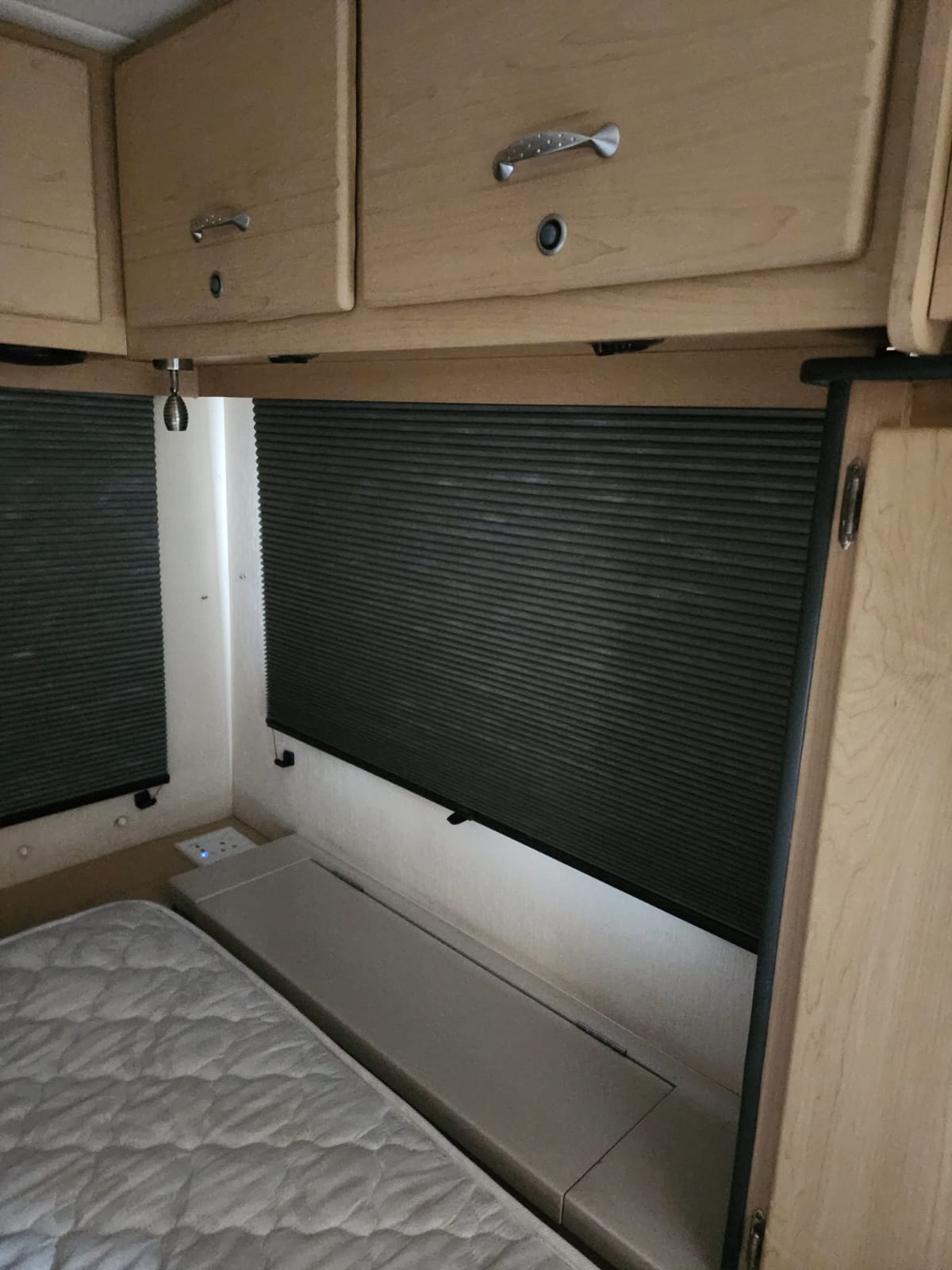 Caravan blind in pleated fabric fitted by Linric Blinds
