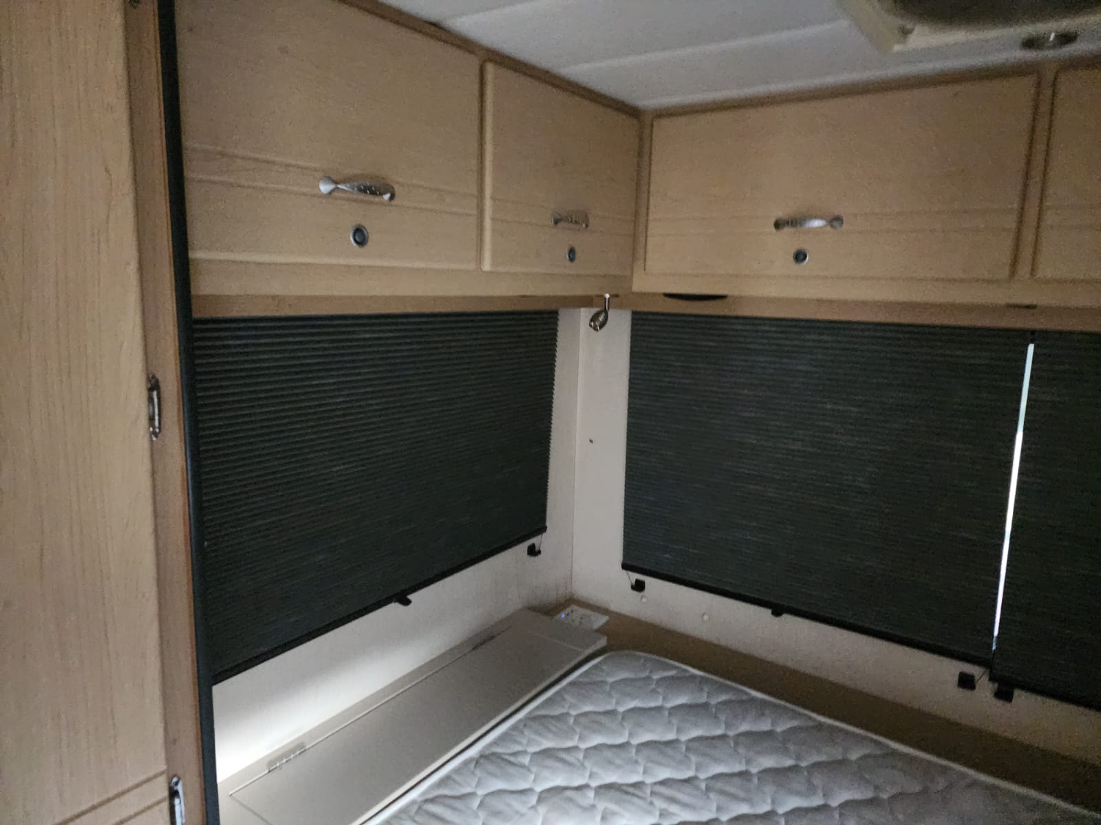 Caravan blind in pleated fabric installed by Linric Blinds