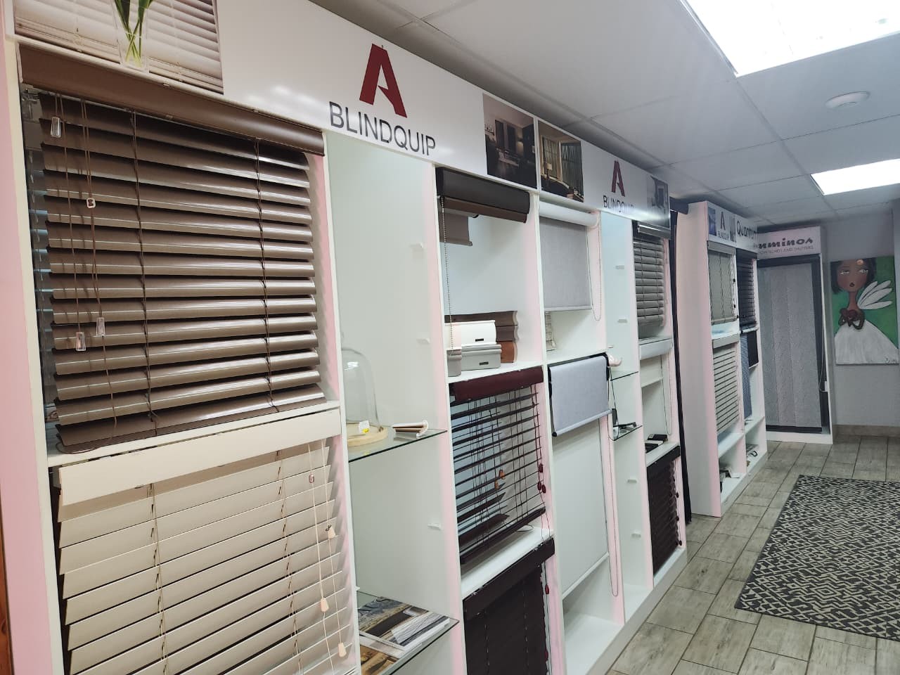 Venetian blind displays along the Linric Blinds showroom