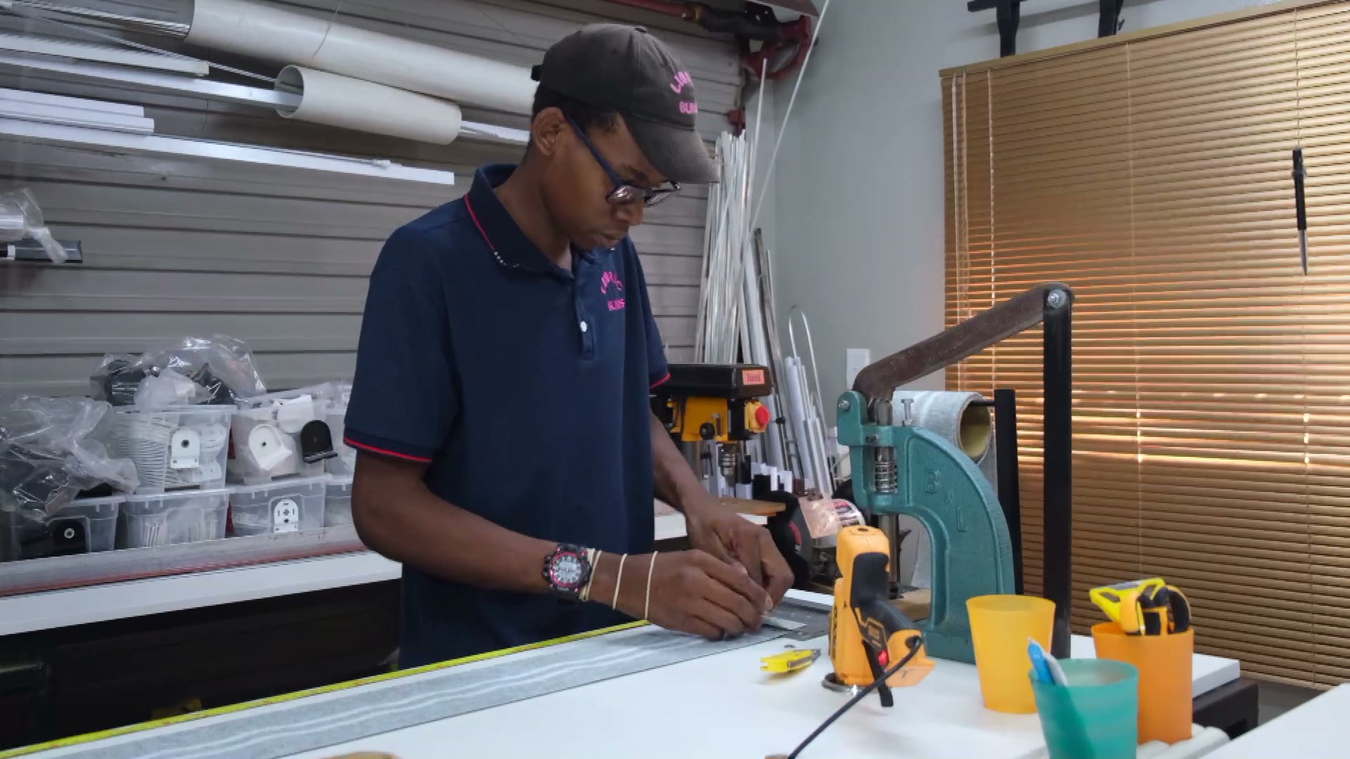 Assembling a blind at the workbench in the Linric Blinds workshop